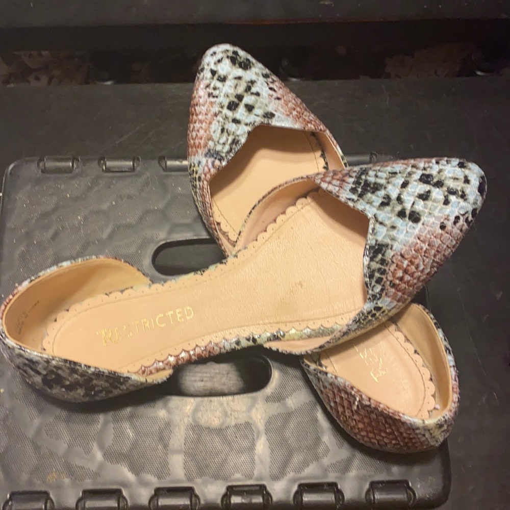Multi color snake skin flats.